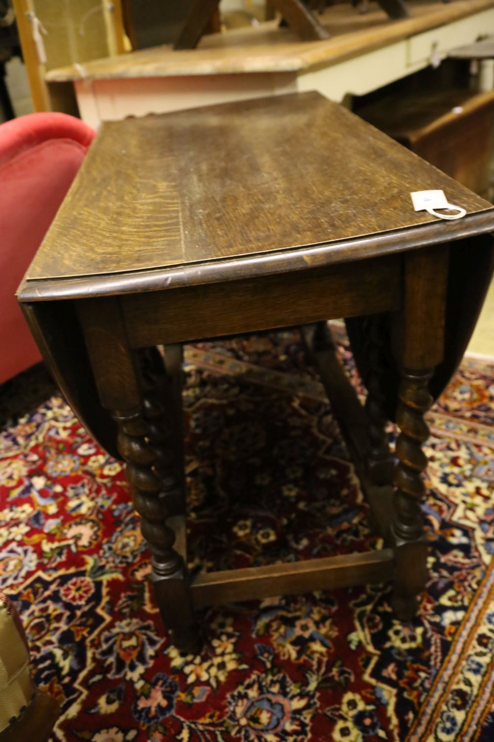 A 1920s oak twist leg gateleg table, width 102cm, depth 54cm, height 72cm